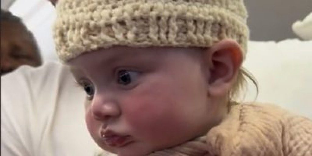 Stranger Knits for Fascinated Baby During Flight